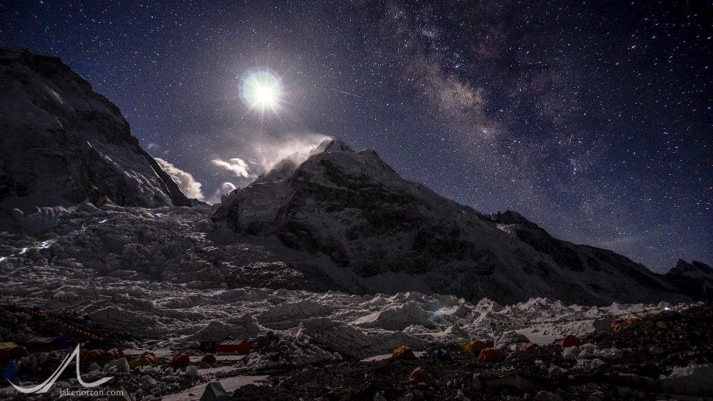 A full moon and the Milky Way rising over Khumbu Basecamp and the Khumbu Icefall on Mount Everest, Nepal.