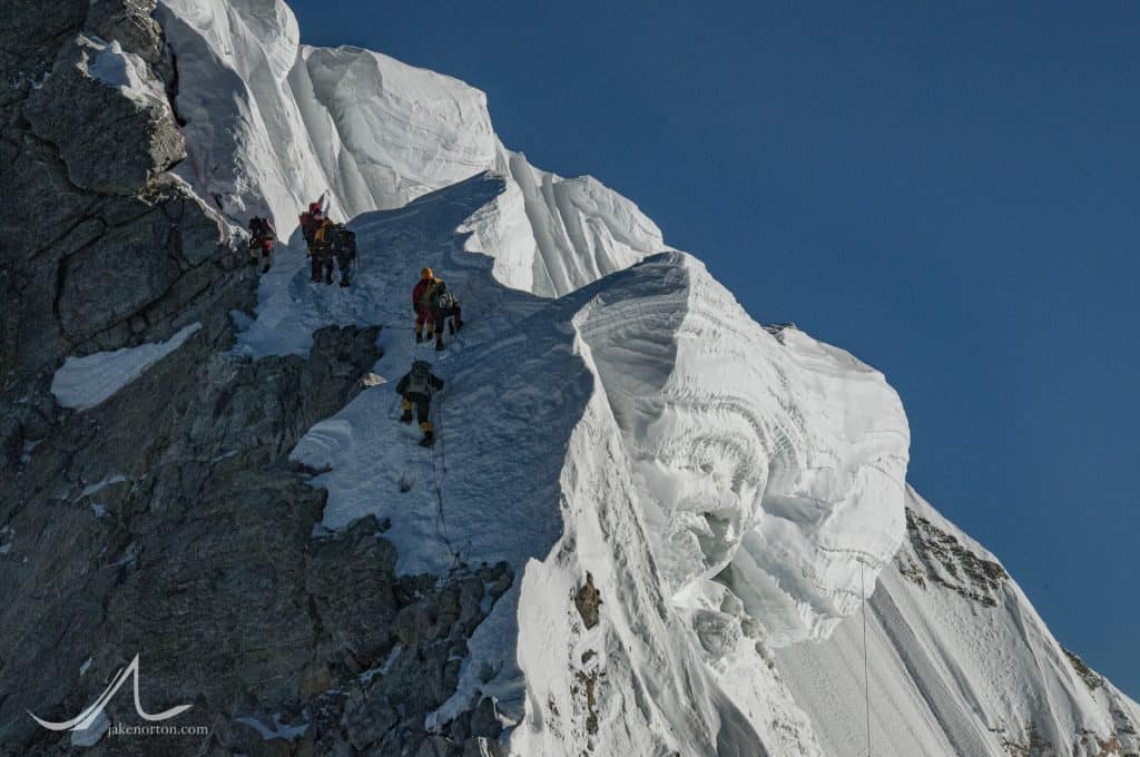 Climbers and cornices at the base of the Hillary Step on Mount Everest, Nepal.