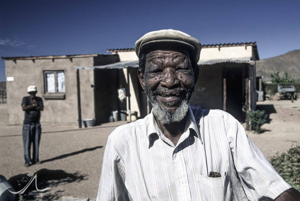 Peter Lord - a former Damara exilee in Namibia - smiles, happy to be back home in Riemvasmaak, South Africa.