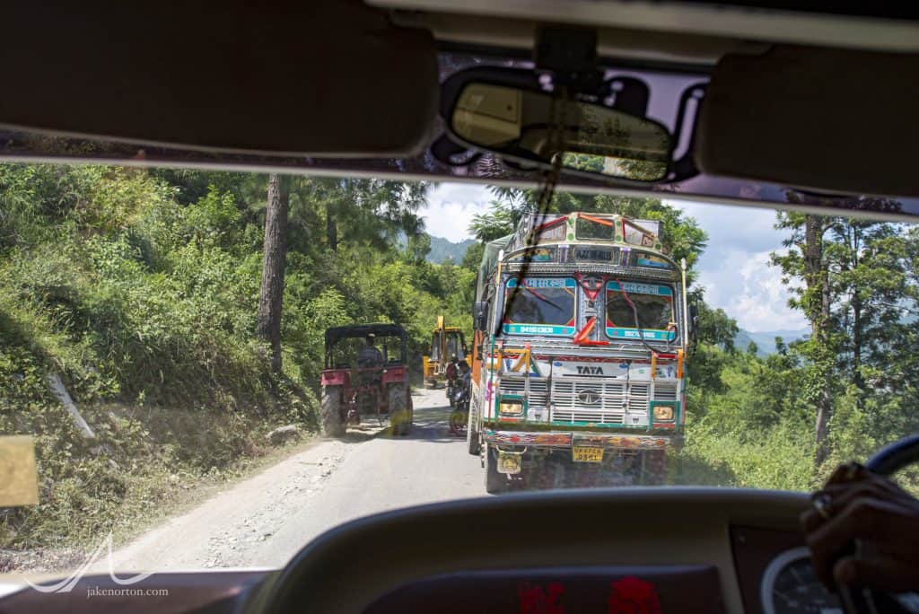 Trucks and buses and all manner of vehicles ply the winding mountain roads of Uttarakhand, India.