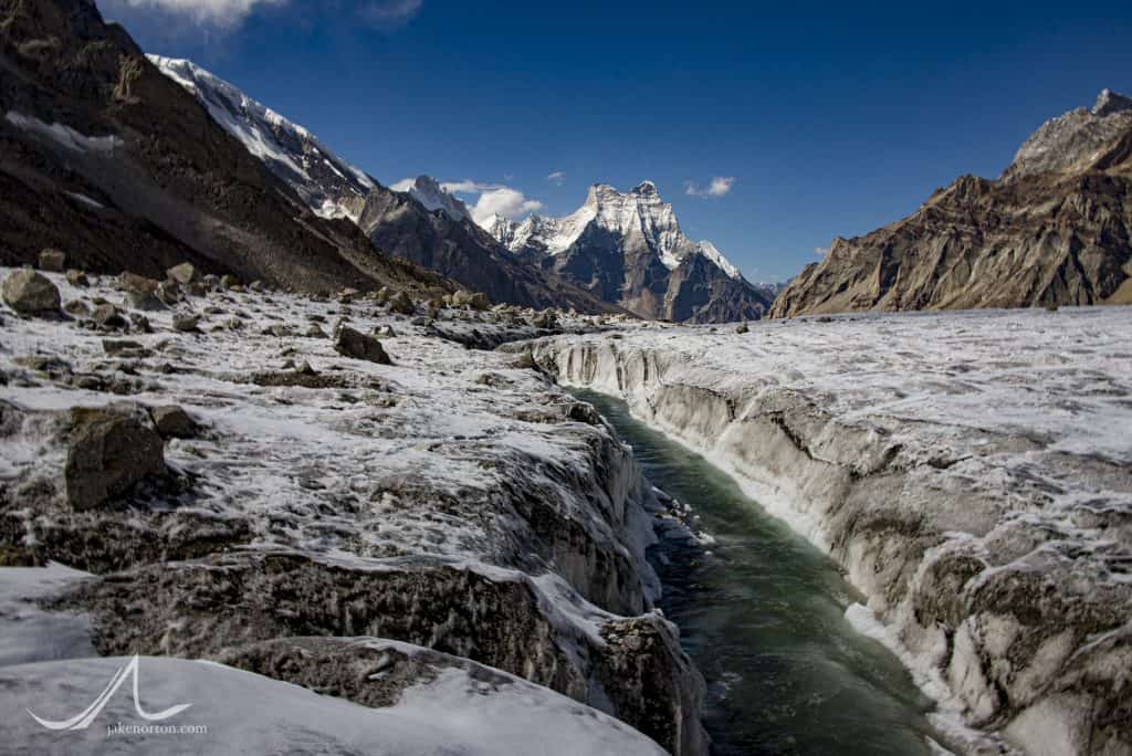 The first waters of the Bhagirathi (Ganges) River flow atop the Gangotri Glacier at over 17,000 feet. Shivling rises down valley.