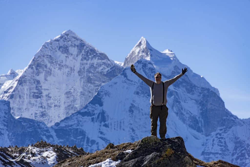 Art Adams enjoying the majesty of the Himalaya with Thamserku rising behind, Solu Khumbu, Nepal.