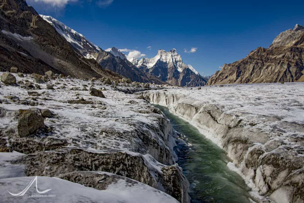 The first waters of the Bhagirathi (Ganges) River flow atop the Gangotri Glacier at over 17,000 feet. Shivling rises down valley.