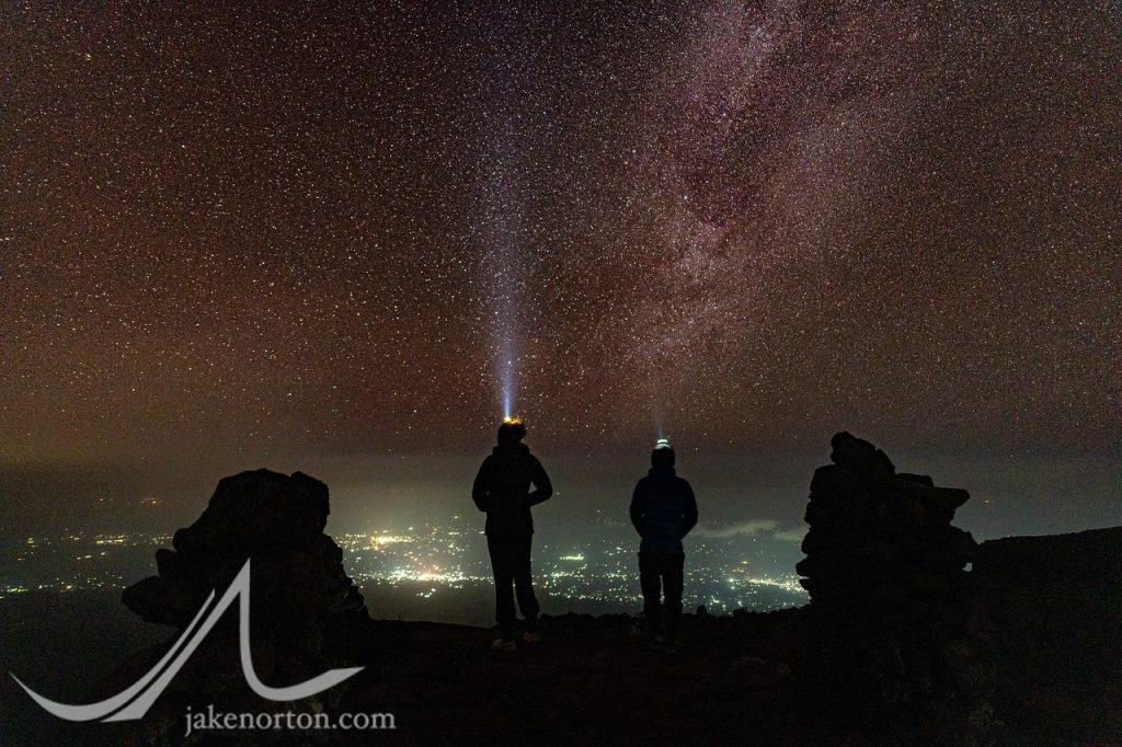 Looking out at the Milky Way and the lights of rural Kenya from Mawenzi Tarn Camp on Mount Kilimanjaro, Tanzania.