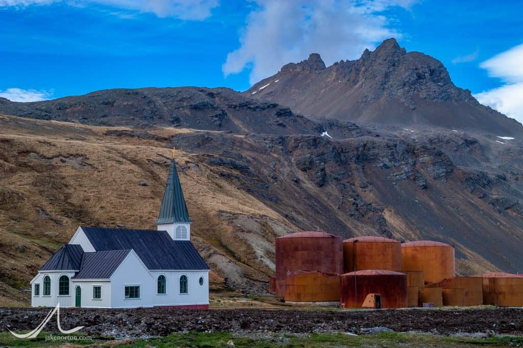 The Norwegian Anglican Church stands next to abandoned equipment of the old whaling station in Grytviken, South Georgia.