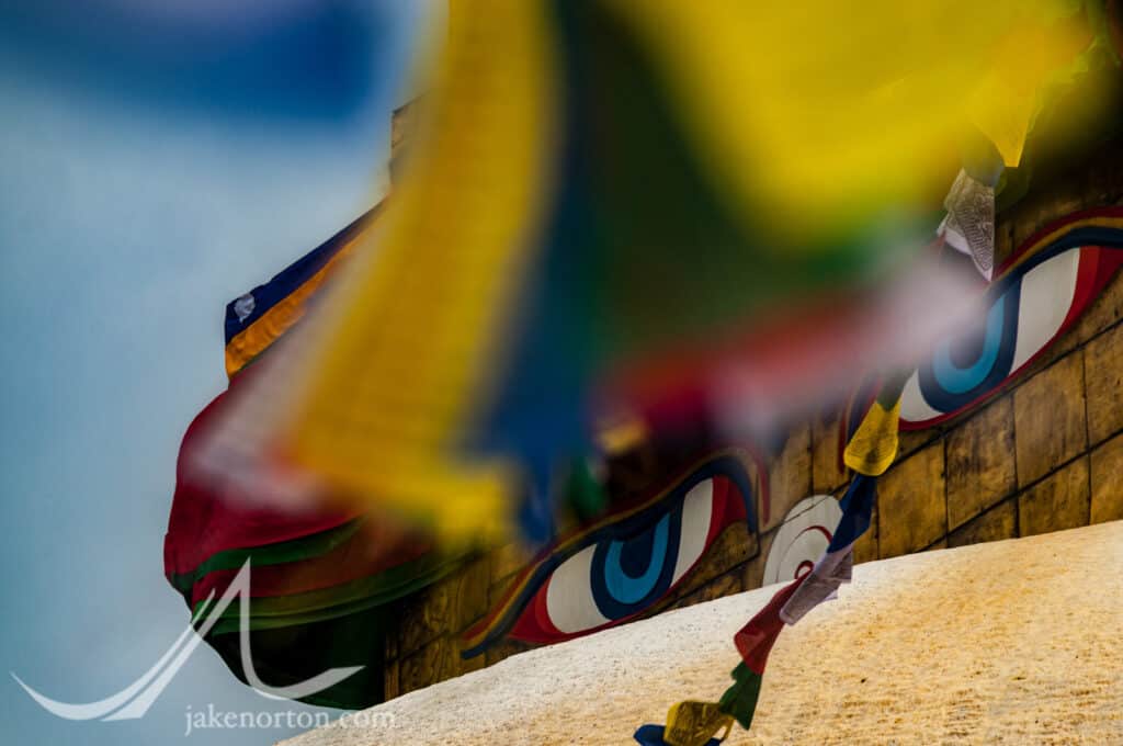 Prayer flags and the all-seeing Eyes of Buddha at Bodhanath Stupa, Kathmandu, Nepal.
