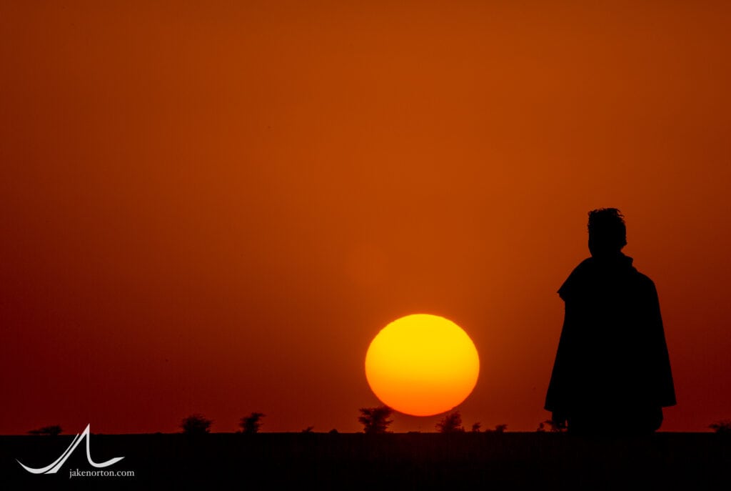 Watching sunset in the Sahara Desert near M'hamid, Morocco.