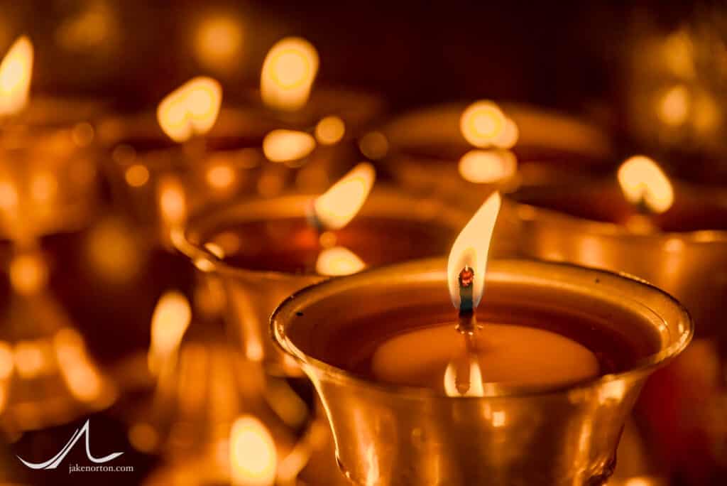 Sacred butter lamps burn at Bodhanath Stupa, Kathmandu, Nepal.