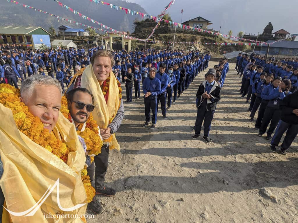 Jake Norton, Jhanak Karki, and Sam Heughan at the welcome ceremony at Chheskam Secondary School, Nepal.