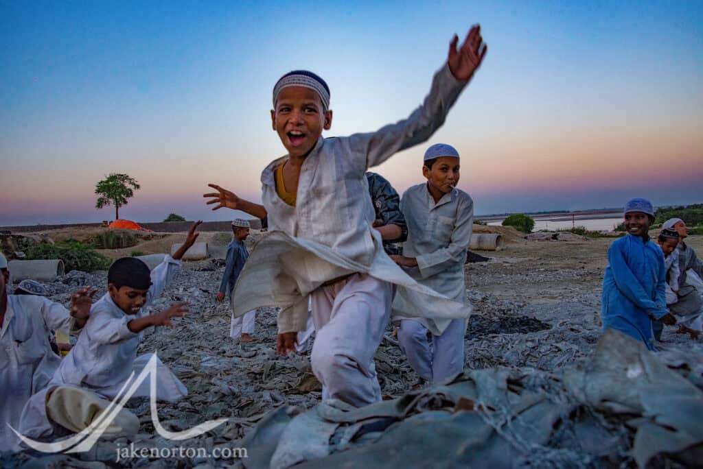 Young muslim boys play on piles of chromium-tainted leather scraps outside their madrasa in Kanpur. Muslims do the majority of the tanning in India, and live amongst the tanneries - and their chemical wastes.